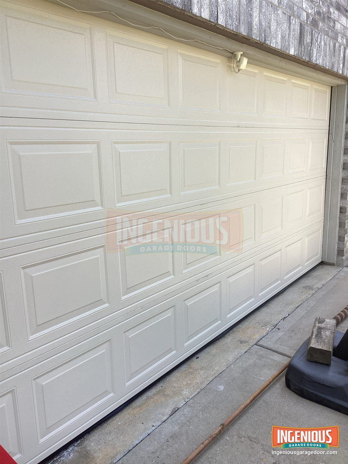 The finished door in factory almond, closed and level.